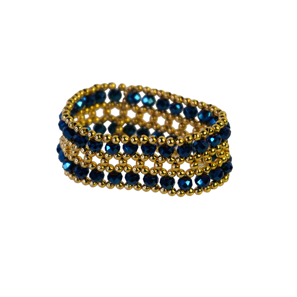 Gold and blue beaded bracelet on a white background