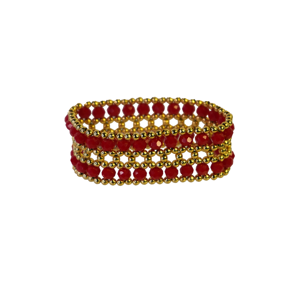 Stack of red and gold beaded bracelets on a white background
