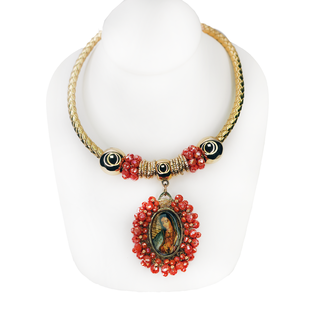 Necklace with red beads and a pendant on a white background