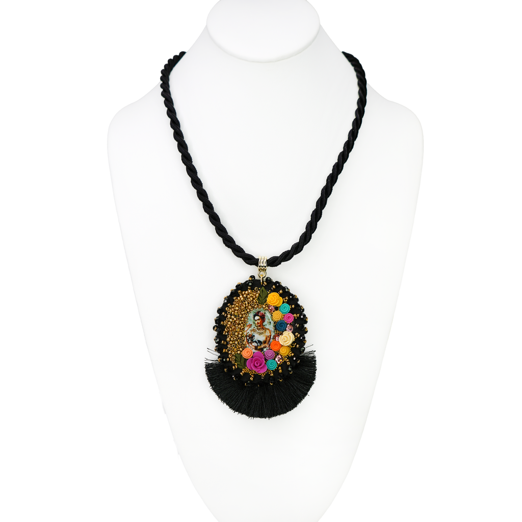 Necklace with a black beaded chain and colorful pendant on a white background