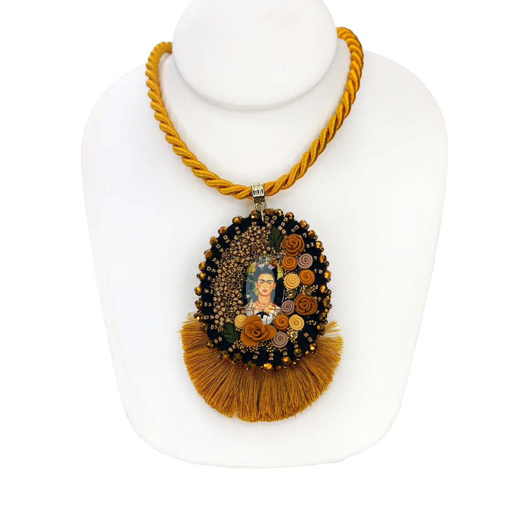 Necklace with decorative pendant on a white mannequin bust